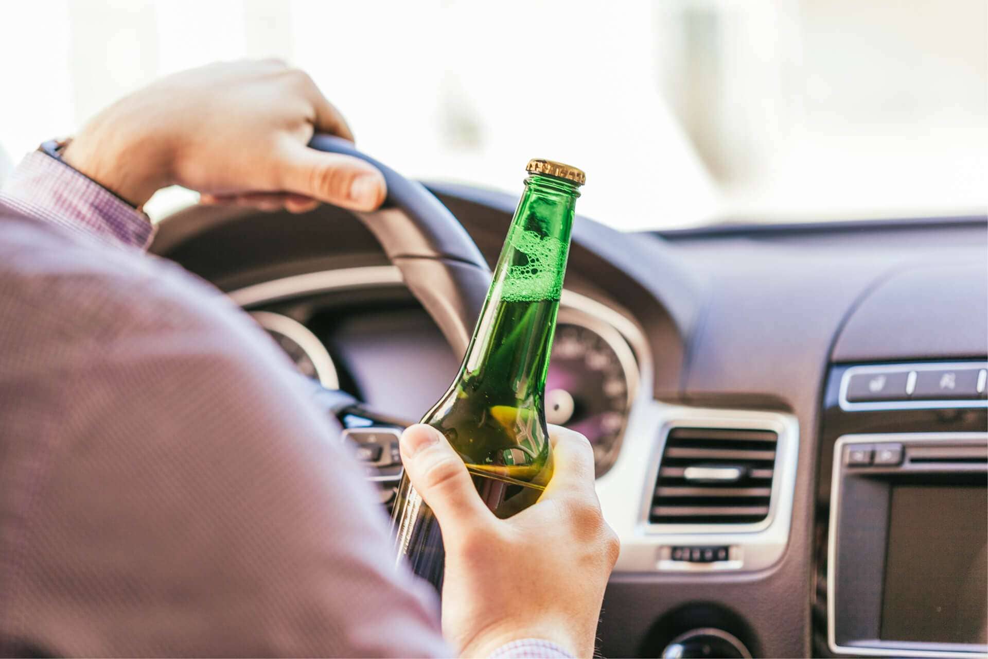 Photo of a Drunk Man Driving Car